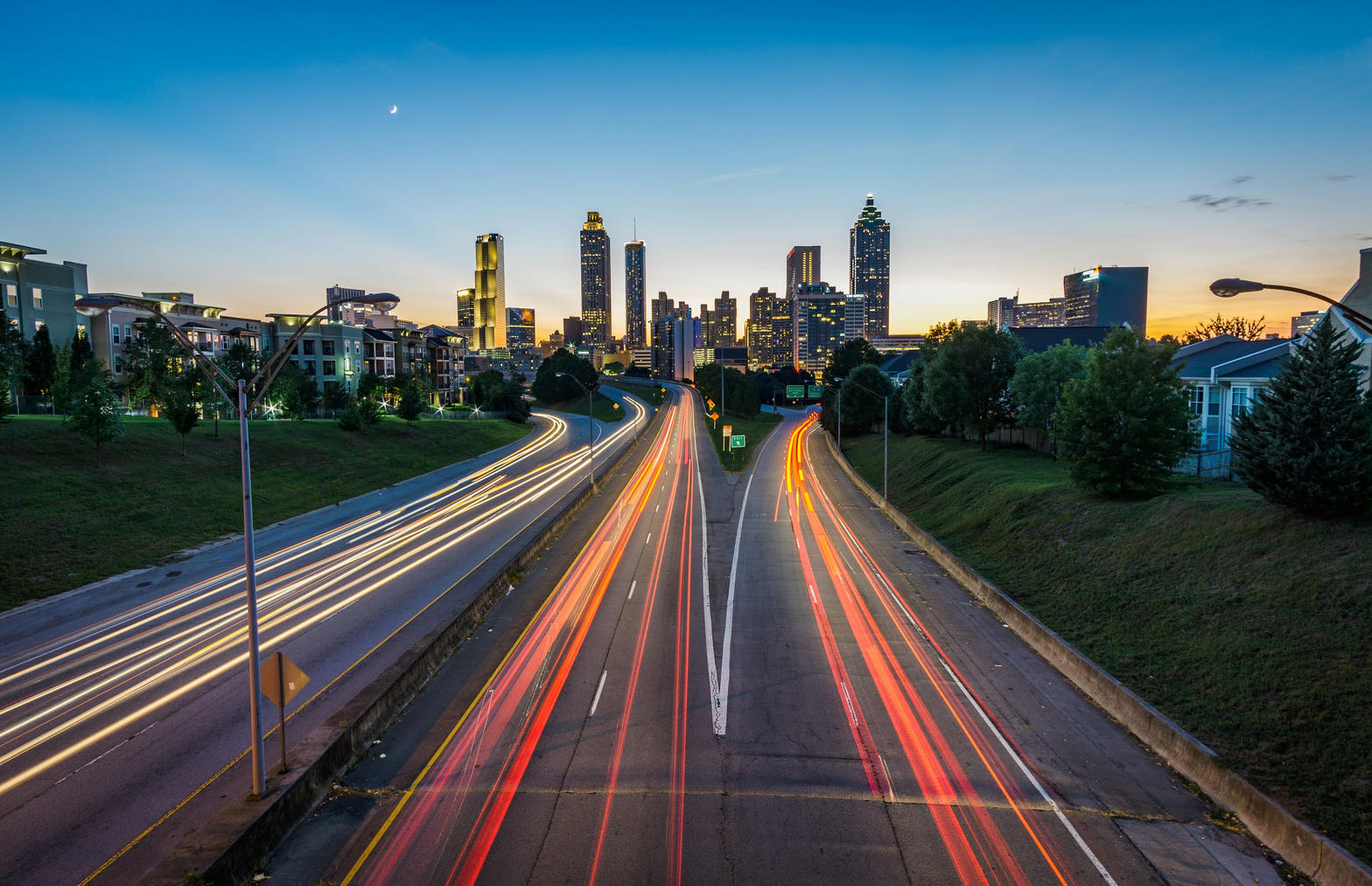 Atlanta skyline at dusk over a highway