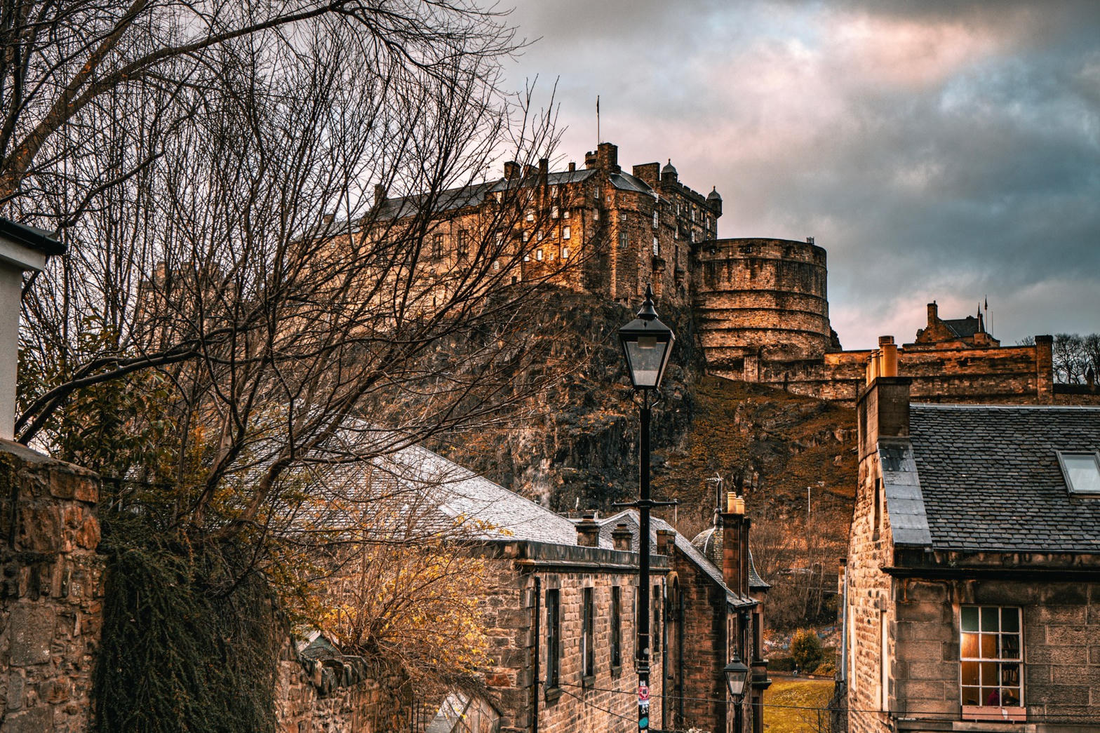 Edinburgh Castle above stone rooftops
