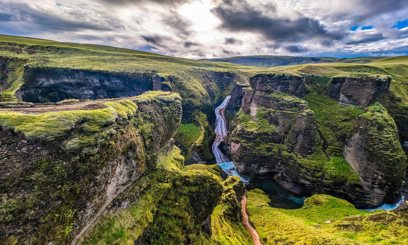 Moss-covered canyon and waterfall in Iceland
