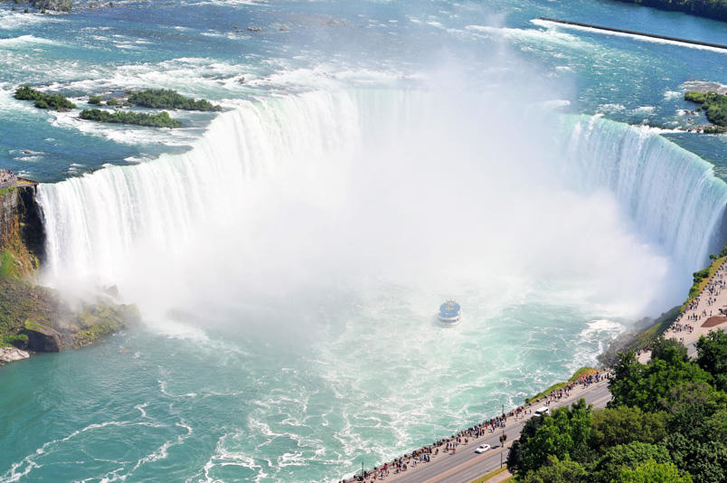 Maid of the Mist boat in the mist at the base of Niagara Falls